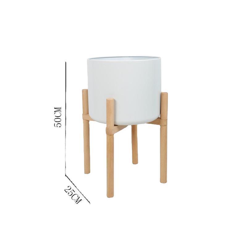 Macetas de cerámica mate de colores con soportes de madera