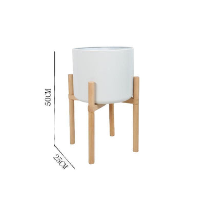 Macetas de cerámica mate de colores con soportes de madera